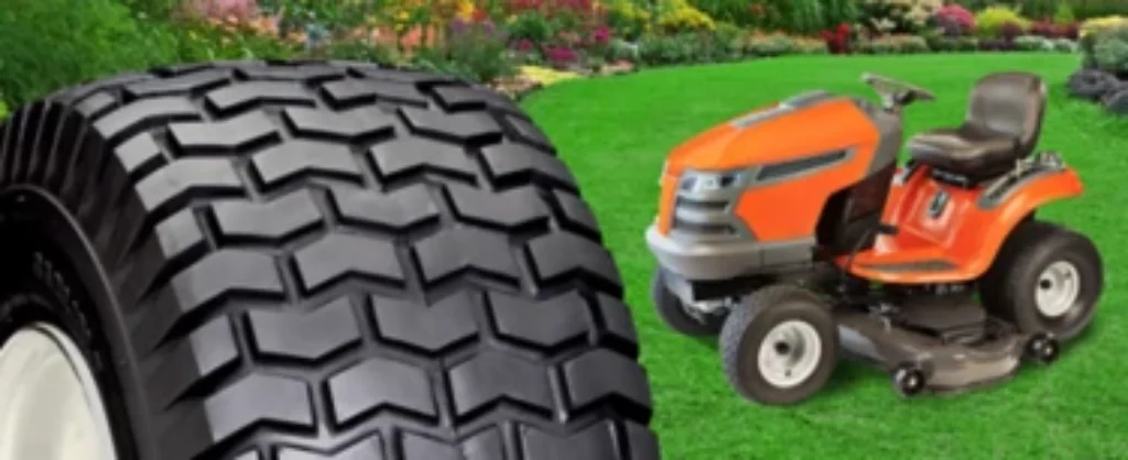 Lawn mower and replacement tire on green grass